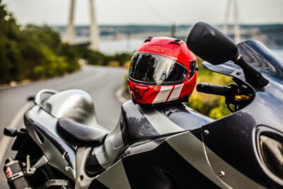 grey black motorcycle red helmet